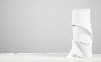 White toilet papers on white desk table.