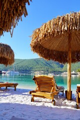 Fototapeta premium Bodrum, Turkey - August 2020: Hotel beach Lujo. Vacation in Paradise. Beautiful tropical beach banner. White sand travel tourism wide panorama background concept. Amazing beach landscape, yachts