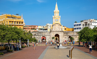 View to Torre de Reloj (Clock Tower) with blue sky and warm light, Cartagena, Colombia, Unesco World Heritage
