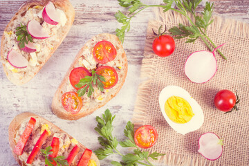 Vintage photo, Fresh prepared baguette with mackerel or tuna fish paste