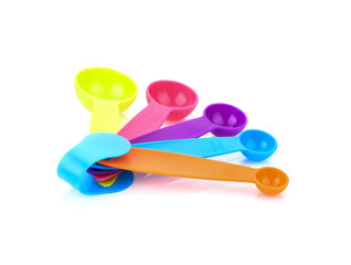 colorful measuring spoons isolated on white