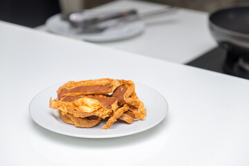 Fried peking duck as served in white plate at restaurant. Chinese style