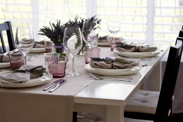 Country style table setting for dinner or lunch with lavender