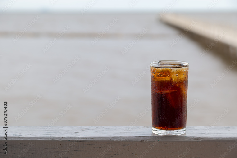 Wall mural cola with ice in the glass ready to drink for refresh