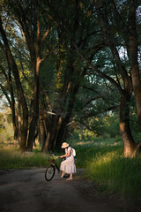 girl in green summer forest