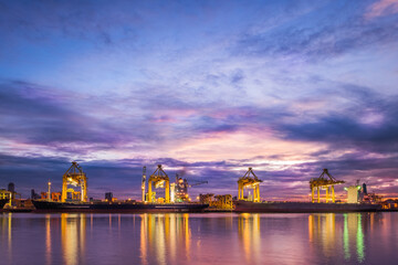Harbor with anchored ship. Container cargo freight ship with working crane bridge at a shipyard in for logistic transportation import and export at Asia haven port background, Samutprakarn, Thailand.