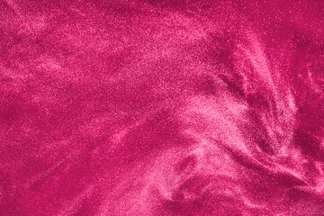 Fototapeta na wymiar de-focused. Abstract elegant, detailed pink glitter particles flow underwater. Holiday magic shimmering luxury background. Festive sparkles and lights. 
