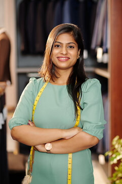 Portrait Of Confident Young Indian Female Entrepreneur Standing In Atelier She Owns