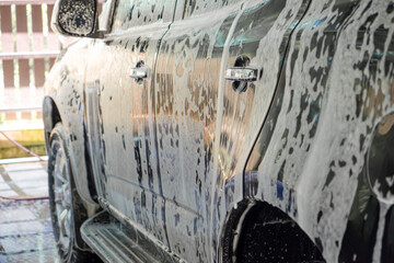 Side view of car wash business to keep clean and care for health of the driver with copy space for your text.