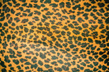 Natural leopard leather texture, useful as a background. Color luxury fabric with pattern rough...