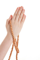 praying hands with buddhist prayer beads on white background