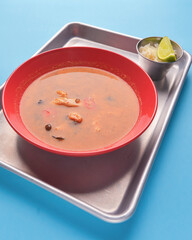 Bowl of Minestrone soup with beans and vegetables. Meat siup with a bowl of rice. Asian cuisine concept.