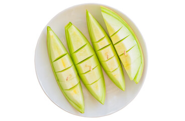 Juicy honeydew melon in dish isolated on white background. Top view