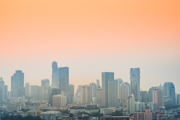 Fototapeta na wymiar Aerial view of the modern buildings and skyscrapers of Bangkok City.