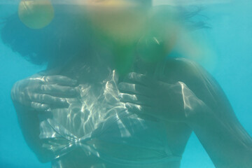 Sexy Model Underwater. Woman With Slim Body In Fashion Swimsuit In Pool. Summer Recreation At SPA Resort.