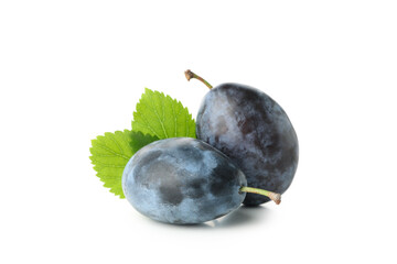 Plums and leaves isolated on white background