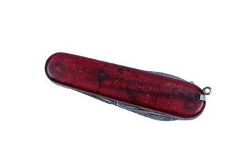 Folded all purpose red pocket knife isolated on a white background