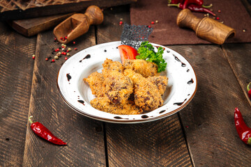 Deep fried shrimps with sauce on the wooden table