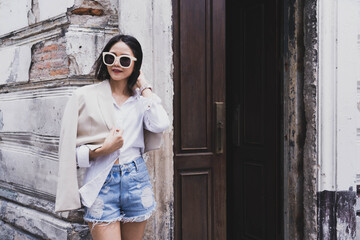Fototapeta premium Fashionable woman with copy space stock photo.Cropped shot of a beautiful young female walking through the city