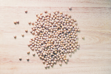 Soy bean on wooden background. Top view