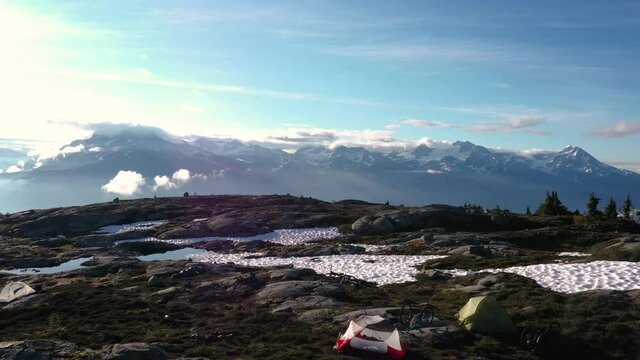 Aerial Reveal Of A Campground On Top Of A Mountain At Sunrise
