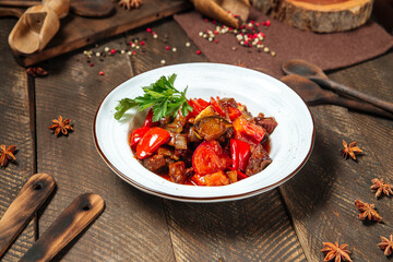 Warm salad with eggplant beef and tomatoes