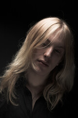 Young man with long blond hair