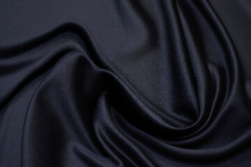 Fabric suit black stretch out of wool. Beautiful background for design.