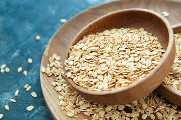 Plate with raw oatmeal on table