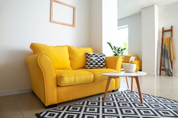Interior of modern studio apartment with comfortable sofa