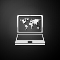 Silver Laptop with world map on screen icon isolated on black background. World map geography symbol. Long shadow style. Vector.