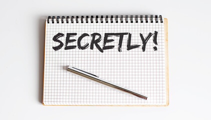 Word Writing Text SECRETLY on notepad . business concept .