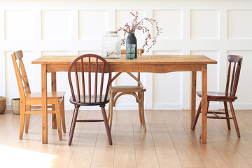 Large wooden table with chairs in the dining room.