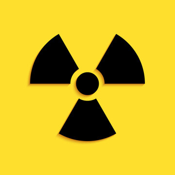 Black Radioactive icon isolated on yellow background. Radioactive toxic symbol. Radiation Hazard sign. Long shadow style. Vector.