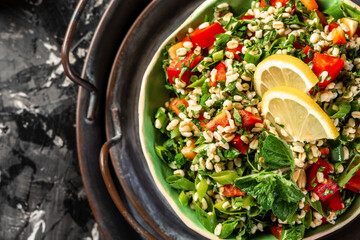 Tabbouleh salad closeup, Part of middle eastern meze. Top view.