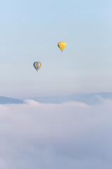 hot air balloon over the clouds