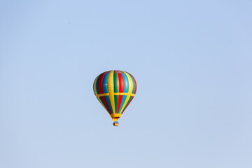 Fototapeta na wymiar hot air balloon over the clouds