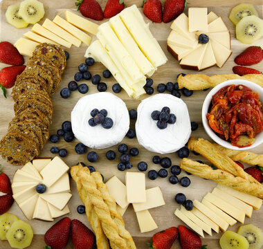 Cheese board with crackers and fruit