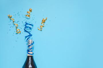 Christmas composition with bottle of champagne on color background