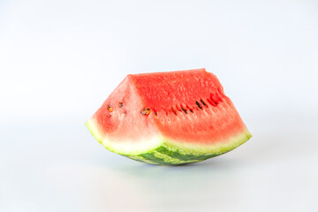 Red ripe watermelon sliced on a white background.