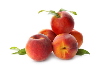 Delicious ripe juicy peaches with leaves isolated on white