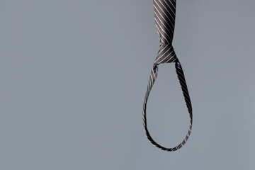 Tie in the form of a loop. Concept of depression at work