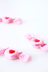 pink candies on white background