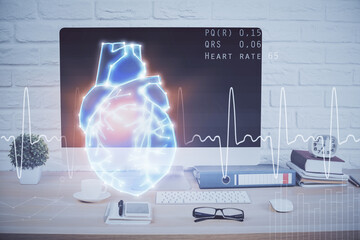 Desktop computer background and heart drawing. Double exposure. Medical study and healthcare concept.