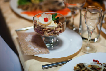 meat salad with slices of pork, beef and chicken with egg