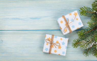 Christmas gift boxes over blue background