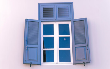vintage blue shutters with white frame window, Athens Greece