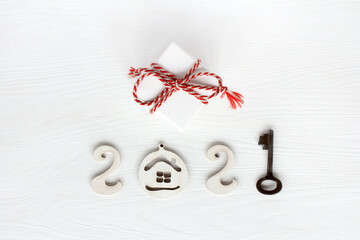 gift with red striped ribbon, number two thousand twenty one from house digits and key. conceptual...