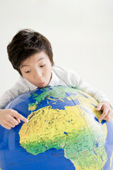 boy holding a globe