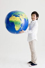 boy holding a globe